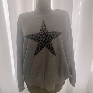 Size 2X sweater with cute leopard print star. Brand new without tags